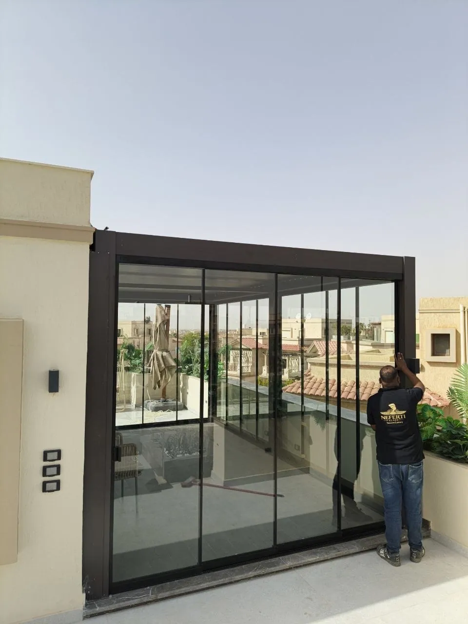 Frameless sliding glass enclosure