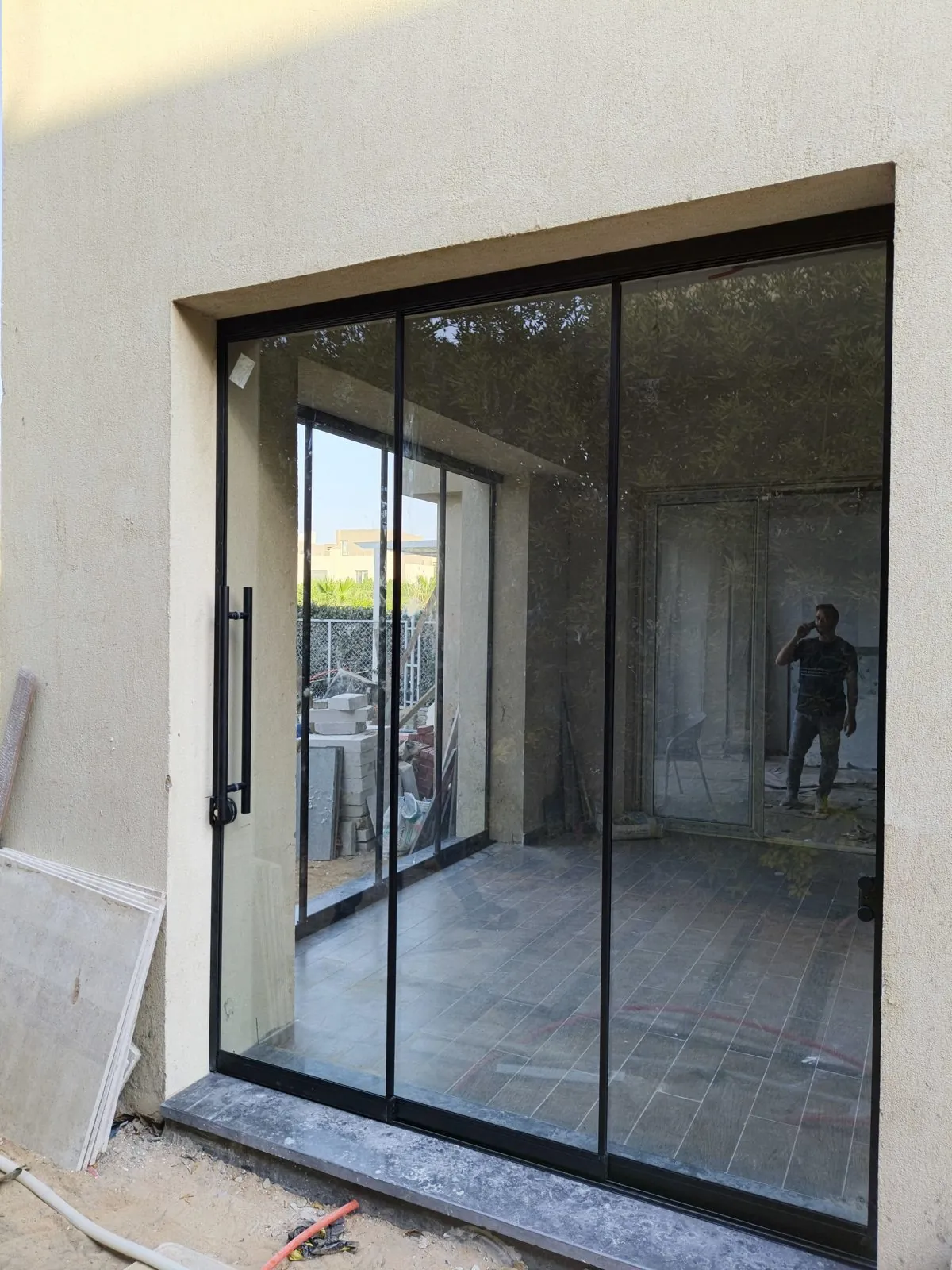 Slim black-framed sliding glass door