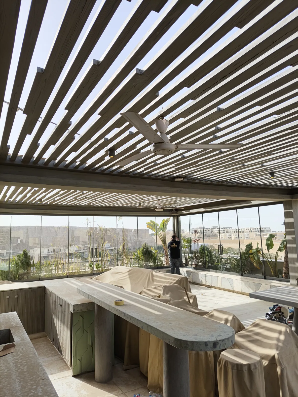 Rooftop terrace glazing under pergola